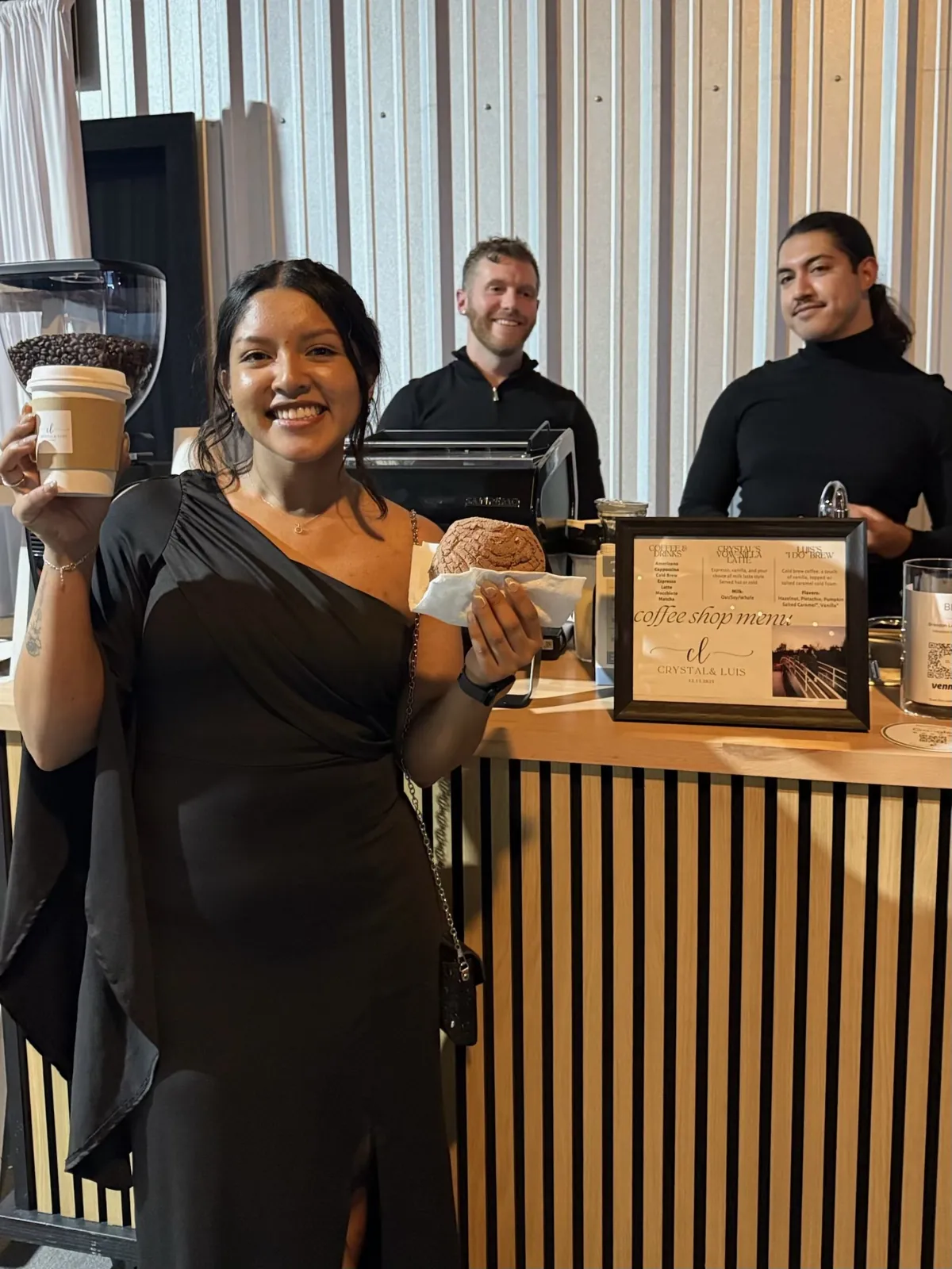 Wedding guest smiling with a latte in front of the Maya's Macchiatos coffee bar in Dallas